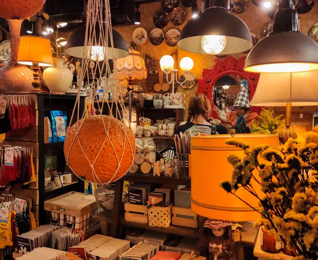 A warm local shop with hanging lamps
