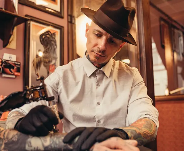 A tattoo artist at work